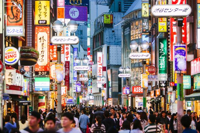 People walking in Shibuya shopping district.