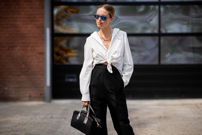 COPENHAGEN, DENMARK - AUGUST 08: Pernille Teisbaek wearing white blouse, black high waisted pants is seen outside Holzweiler during the Copenhagen Fashion Week Spring/Summer 2019 on August 8, 2018 in Copenhagen, Denmark. (Photo by Christian Vierig/Getty Images)