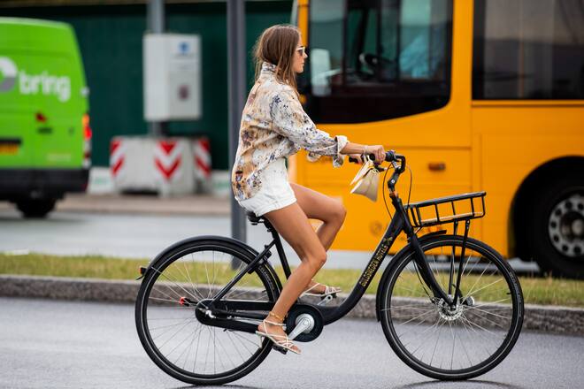 COPENHAGEN, DENMARK - AUGUST 06: Nina Sandbech is seen on a bike wearing white shorts and button shirt with print outside Brøgger during Copenhagen Fashion Week Spring/Summer 2020 on August 06, 2019 in Copenhagen, Denmark. (Photo by Christian Vierig/Getty Images)