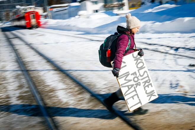 16 year-old Swedish climate activist Greta Thunberg arrives by train to attend the 49th Annual Meeting of the World Economic Forum, WEF, in Davos, Switzerland, Wednesday, January 23, 2019. Starting the first school strike for climate outside the Swedish parliament building aiming to raise awareness of global warming Greta Thunberg has inspired tens of thousands of student over the globe to organize their own strikes to further raise government awareness on climate change. (KEYSTONE/Valentin Flauraud)