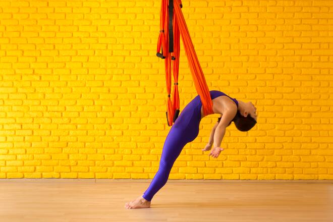Young Woman doing Antigravity Yoga