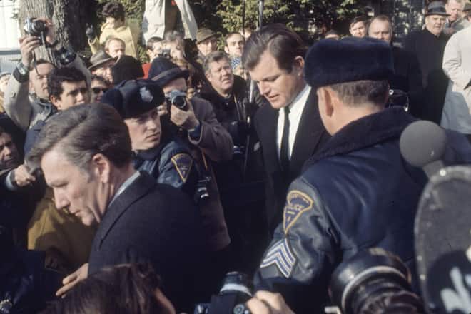 American politician US Senator Ted Kennedy (1932 - 2009) (center, in necktie) leaves the Inquest into the death of Mary Jo Kopechne, Edgartown, Massachusetts, January 1970. The previous year (on July 18, 1969) Kennedy had driven his car off of a bridge on Chappaquiddick Island--he swam to the shore, but his passenger, Mary Jo Kopechne, was found dead in the car hours later. (Photo by Steve Hansen/The LIFE Images Collection via Getty Images)