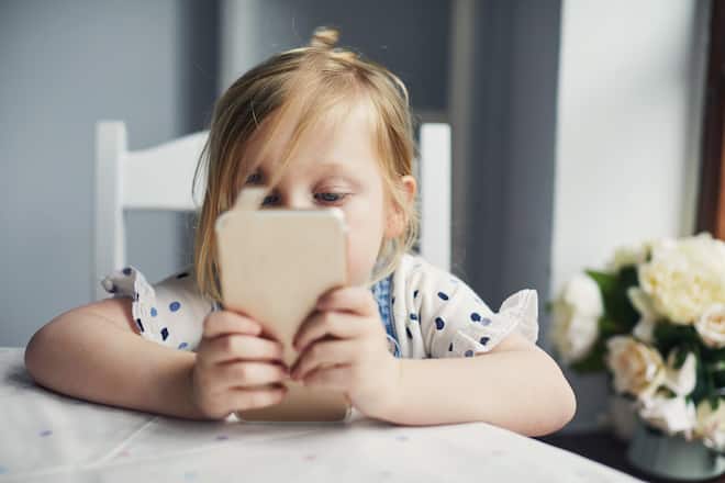Toddler girl using a smartphone