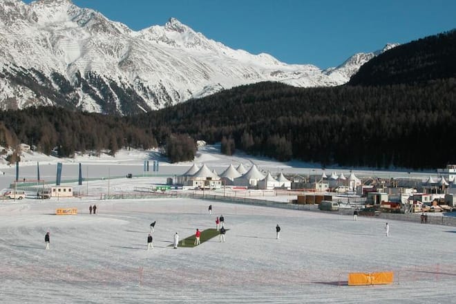 wide view on a cricket game on ice