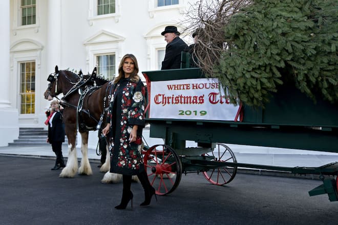 U.S. First Lady Melania Trump stands next to the White House Christmas Tree at the North Portico of the White House in Washington, D.C., U.S., on Monday, Nov. 25, 2019. Larry Snyder of Mahantongo Valley Farms presented the Pennsylvania-grown Christmas Tree to Melania Trump and the tree will be displayed in the White House Blue Room. Photographer: Andrew Harrer/Bloomberg via Getty Images
