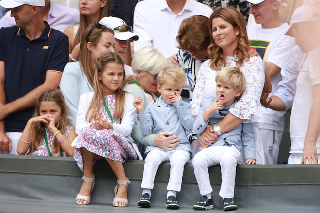 LONDON, ENGLAND - JULY 16: Roger Federer's wife Mirka Federer and their four children, identical twin daughters Myla and Charlene, 7, and identical 3-year-old twin sons Leo and Lenny, cheer from the stands after the Gentlemen's Singles final won by Roger Federer during the Wimbledon Lawn Tennis Championships at the All England Lawn Tennis and Croquet Club at Wimbledon on July 16, 2017 in London, England. (Photo by Tim Clayton/Corbis via Getty Images)