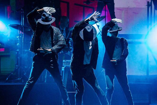 stage with three dancers styled like michael jackson