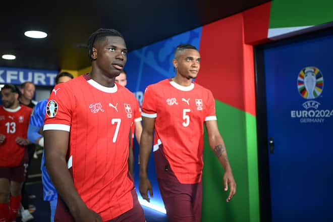 FRANKFURT AM MAIN, GERMANY - JUNE 23: Breel Embolo and Manuel Akanji of Switzerland walk out of the tunnel during the UEFA EURO 2024 group stage match between Switzerland and Germany at Frankfurt Arena on June 23, 2024 in Frankfurt am Main, Germany. (Photo by Alexander Scheuber - UEFA/UEFA via Getty Images)