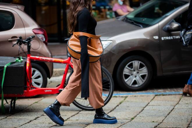 MILAN, ITALY - SEPTEMBER 23: A guest is seen wearing brown pants and bag outside Simona Marziali during the Milan Women's Fashion Week on September 23, 2020 in Milan, Italy. (Photo by Christian Vierig/Getty Images)