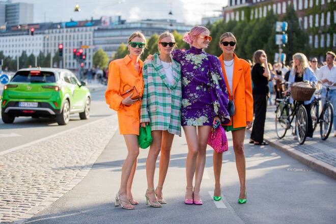 COPENHAGEN, DENMARK - AUGUST 11: Annabel Rosendahl, Tine Andrea wearing green checkered oversized blazer Darja Barannik wearing orange dress, blazer, purple dress seen outside Baum und Pferdgarten on August 11, 2021 in Copenhagen, Denmark. (Photo by Christian Vierig/Getty Images)