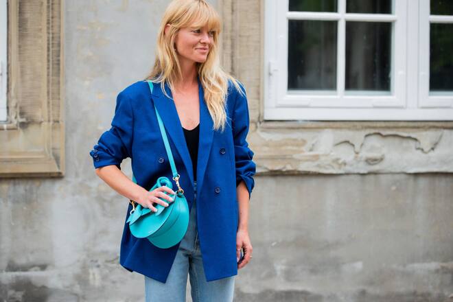 COPENHAGEN, DENMARK - AUGUST 08: Jeannette Madsen wearing blue blazer, denim jeans outside Designers Remix during Copenhagen Fashion Week Spring/Summer 2020 on August 08, 2019 in Copenhagen, Denmark. (Photo by Christian Vierig/Getty Images)