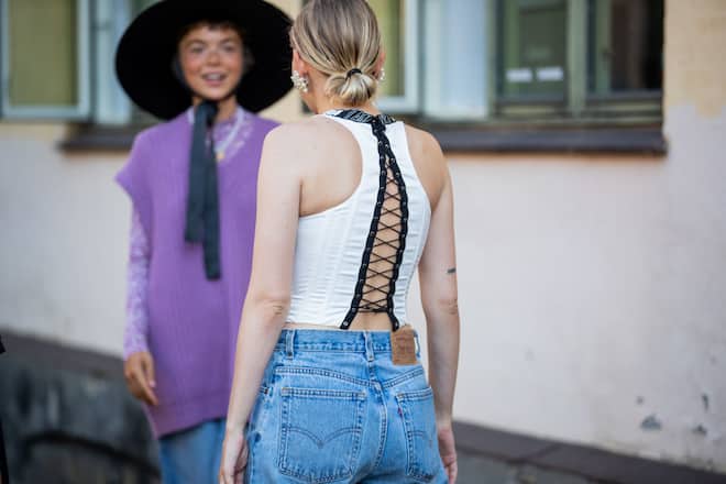 COPENHAGEN, DENMARK - AUGUST 11: A guest is seen wearing laced top outside Samsøe & Samsøe during Copenhagen Fashion Week Spring/Summer 2021 on August 11, 2020 in Copenhagen, Denmark. (Photo by Christian Vierig/Getty Images)