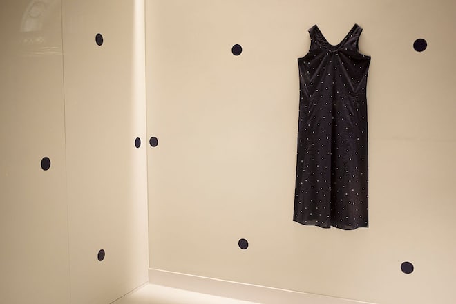 Black polka dot dress in a shop window display. London, UK. The minimal fashion design statement in the dress is echoed in the interior design. (Photo by In Pictures Ltd./Corbis via Getty Images)