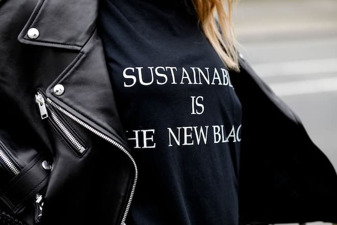 DUSSELDORF, GERMANY - MARCH 20: Black T-shirt with "sustainable is the new black" print by Redemption a a detail of influencer Gitta Banko during a street style shooting on March 20, 2020 in Dusseldorf, Germany. (Photo by Isa Foltin/Getty Images)