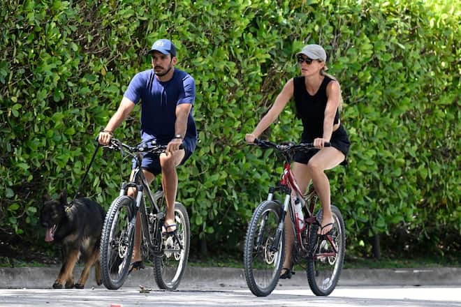 SURFSIDE, FL - JULY 14: Joaquim Valente and Gisele Bündchen are seen on a bike ride on July 14, 2024 in Surfside, Florida. (Photo by MEGA/GC Images)