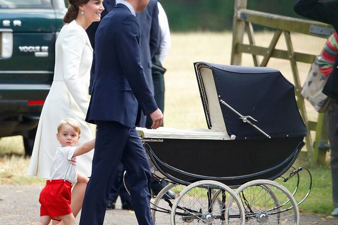 KING'S LYNN, UNITED KINGDOM - JULY 05: (EMBARGOED FOR PUBLICATION IN UK NEWSPAPERS UNTIL 48 HOURS AFTER CREATE DATE AND TIME) Catherine, Duchess of Cambridge pushes daughter Princess Charlotte of Cambridge in her pram as she, Prince William, Duke of Cambridge and Prince George of Cambridge attend the christening of Princess Charlotte of Cambridge at the church of St Mary Magdalene on the Sandringham Estate on July 5, 2015 in King's Lynn, England. (Photo by Max Mumby/Indigo/Getty Images)