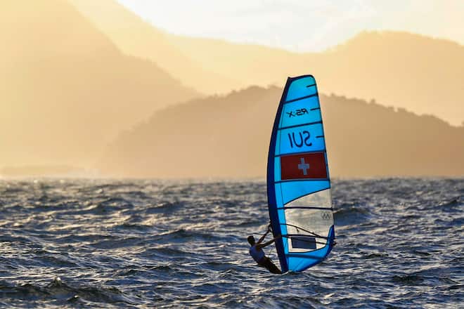 epa05478521 Mateo Sanz Lanz of Switzerland sails during the men's RS:X class race of the Rio 2016 Olympic Games Sailing events in Rio de Janeiro, Brazil, 12 August 2016. EPA/NIC BOTHMA