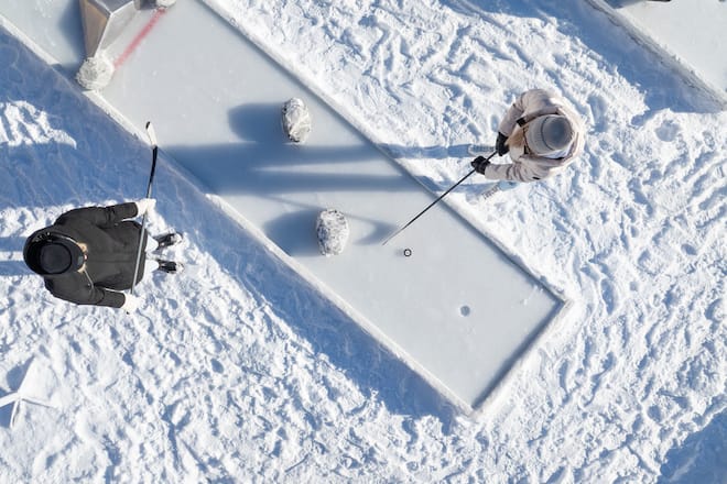 two people playing ice mini golf from above