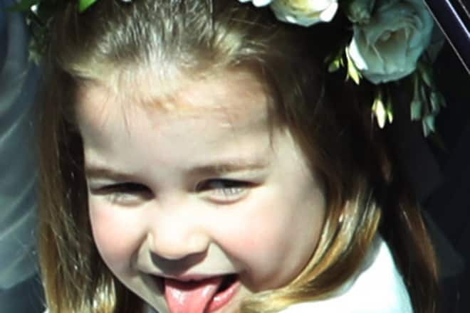 WINDSOR, ENGLAND - MAY 19: Princess Charlotte rides in a car to the wedding of Prince Harry and Meghan Markle at St George's Chapel in Windsor Castle on May 19, 2018 in Windsor, England. (Photo by Andrew Milligan - WPA/Getty Images)