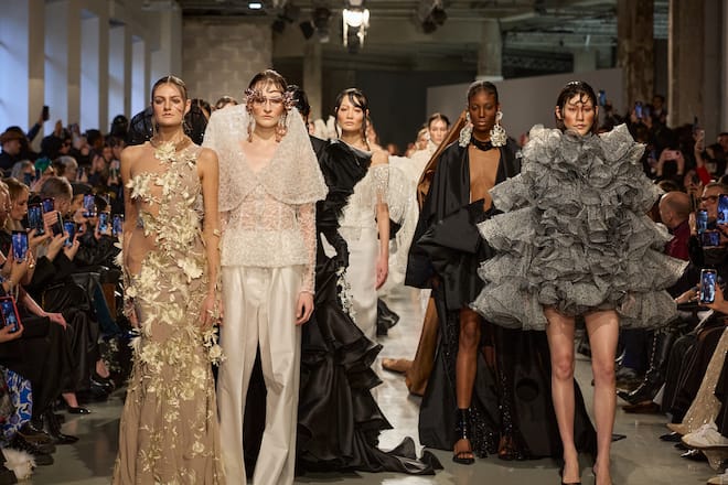 modeln in shiny dresses on a runway