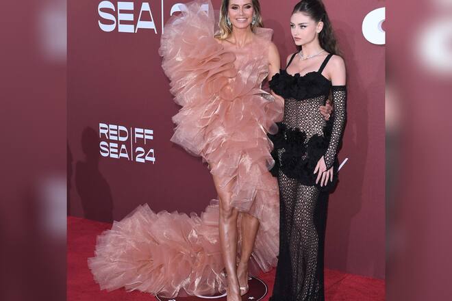 Stoffexplosion versus Netzkleid: Heidi Klum und Tochter Leni zeigen unterschiedliche Looks in Cannes.