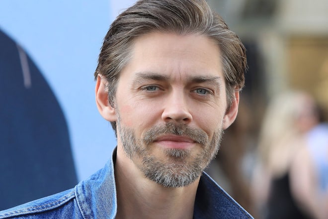 Tom Payne fühlt sich in den USA nicht mehr wohl.