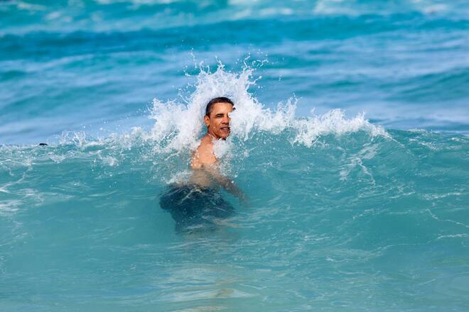 KANEOHE BAY, HI - JANUARY 1: In this handout from the White House, U.S. President Barack Obama jumps into the ocean at Pyramid Rock Beach January 1, 2013 in Kaneohe Bay, Hawaii. Obama is currently on vacation in his native state. (Photo by Pete Souza/The White House via Getty Images)