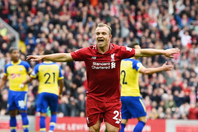 LIVERPOOL, ENGLAND - SEPTEMBER 22: (THE SUN OUT, THE SUN ON SUNDAY OUT) Xherdan Shaqiri of Liverpool scores the opener and celebrates during the Premier League match between Liverpool FC and Southampton FC at Anfield on September 22, 2018 in Liverpool, United Kingdom. (Photo by Andrew Powell/Liverpool FC via Getty Images)