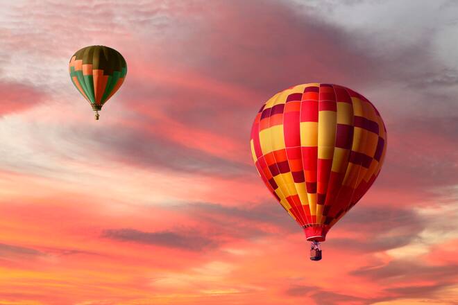 Auszeit Two Colorful Hot Air Balloons Ascending During a Beautiful Sunrise