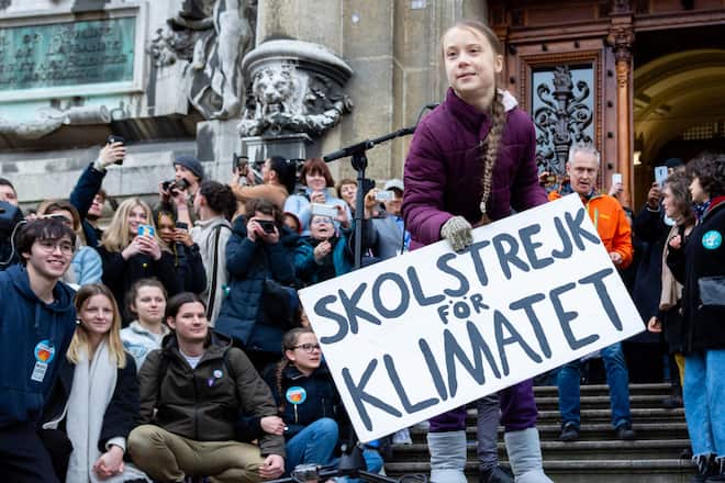 LAUSANNE, SWITZERLAND - JANUARY 17: Greta Thunberg takes her placard after her speech during 1st Anniversary Climate Strike in Lausanne on January 17, 2020 in Lausanne, Switzerland. Swedish climate campaigner Greta Thunberg joined protesters on the streets of Lausanne, days before the start of the Davos summit. (Photo by RvS.Media/Basile Barbey/Getty Images)