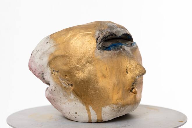 sculpture of a head on a table