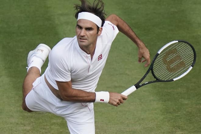 Photo taken July 6, 2018, shows Roger Federer of Switzerland playing against Jan-Lennard Struff of Germany in the third round of the Wimbledon tennis tournament in London. (Photo by Kyodo News via Getty Images)