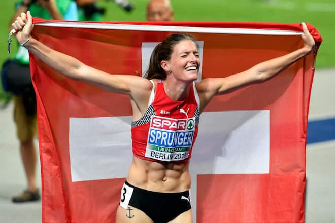 Switzerland's Lea Sprunger celebrates after win the gold medal in the women's 400m hurdles final at the 2018 European Athletics Championships in the Olympiastadion stadium in Berlin, Germany, Friday, August 10, 2018. The 2018 European Athletics Championships will be held in Berlin from August 06 until 12, 2018. (KEYSTONE/Walter Bieri)