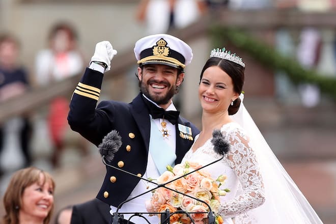 STOCKHOLM, SWEDEN - JUNE 13: Prince Carl Philip of Sweden and his wife Princess Sofia of Sweden salute the crowd after their marriage ceremony on June 13, 2015 in Stockholm, Sweden. (Photo by Ragnar Singsaas/Getty Images)